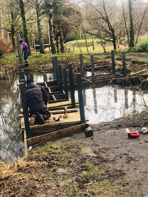 Decking being added to the walkway framework